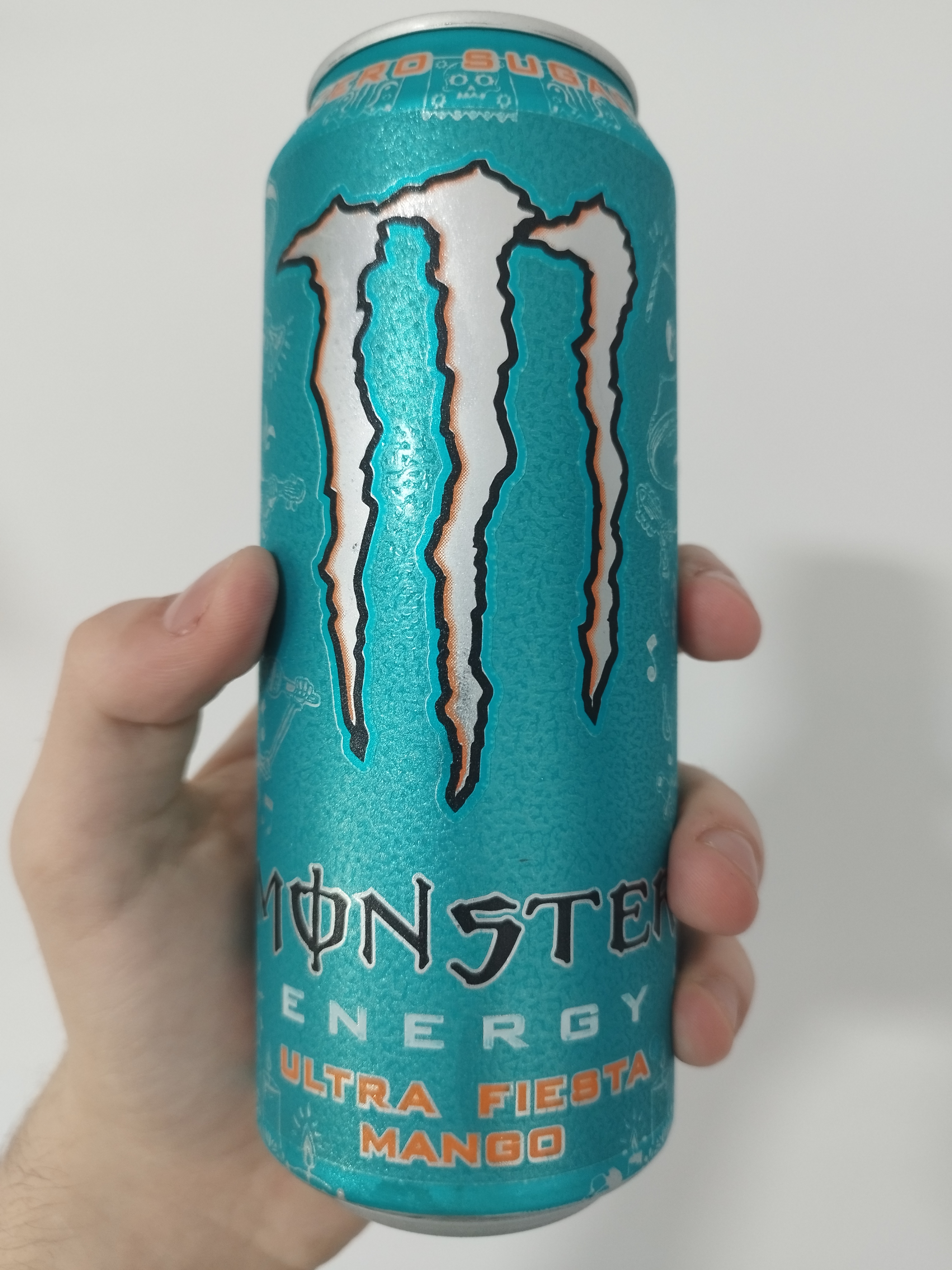 a cyan can of ultra fiesta. there are Day of the Dead scribbles around the logo.